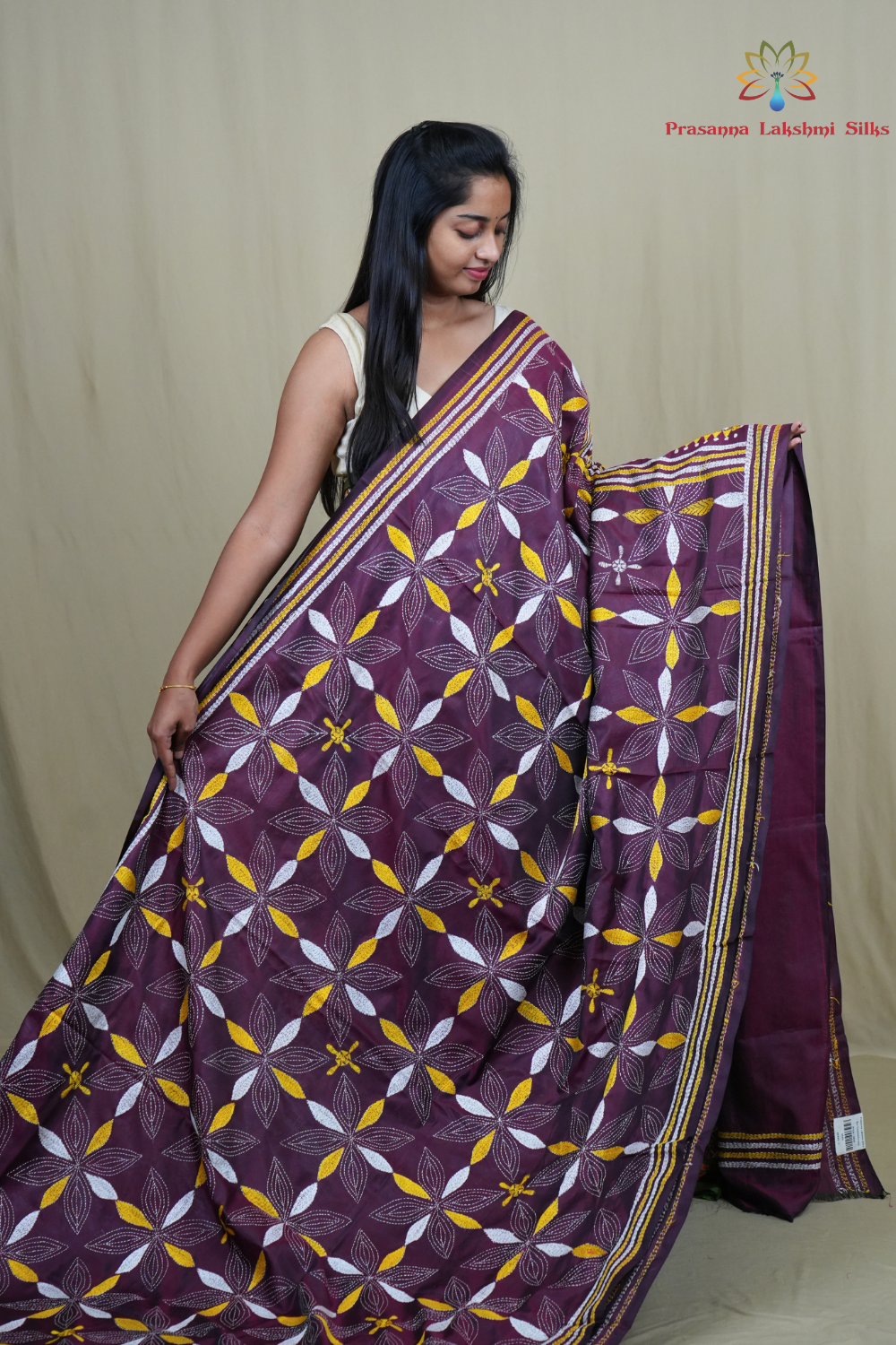 Elegant silk saree featuring Kantha work borders and detailed Kantha pallu design.

