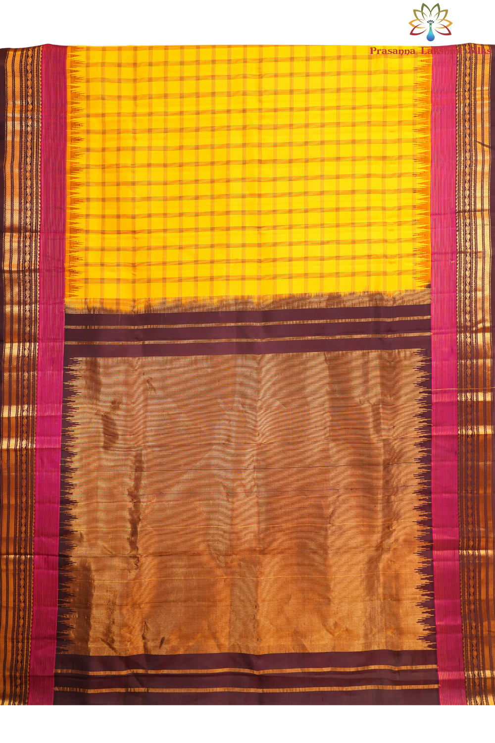 Traditional Gadwal silk saree featuring zari woven temple borders and contrast blouse.
