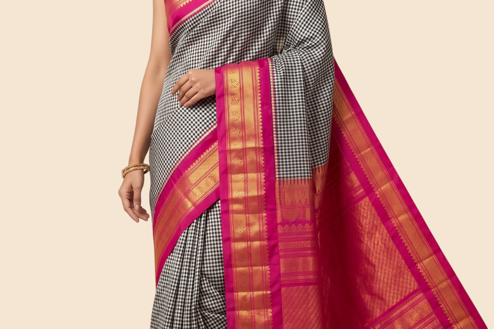 Handloom Gadwal pure silk saree with classic checks pattern and rich zari brocade pallu.
