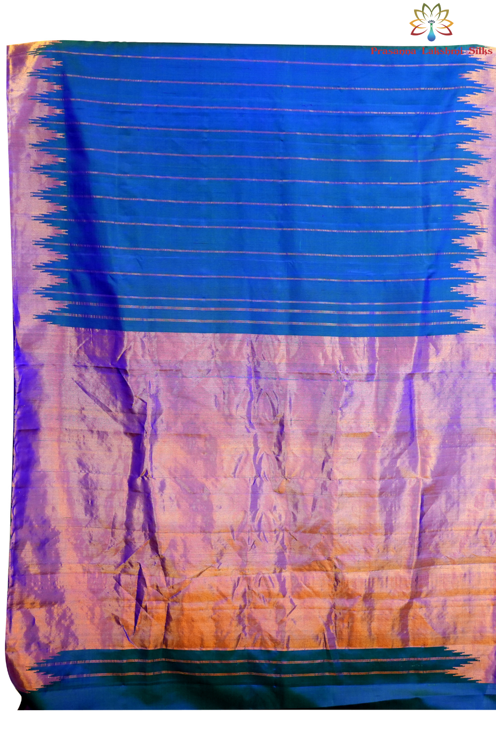 Traditional Gadwal silk saree featuring zari woven temple borders and contrast blouse.
