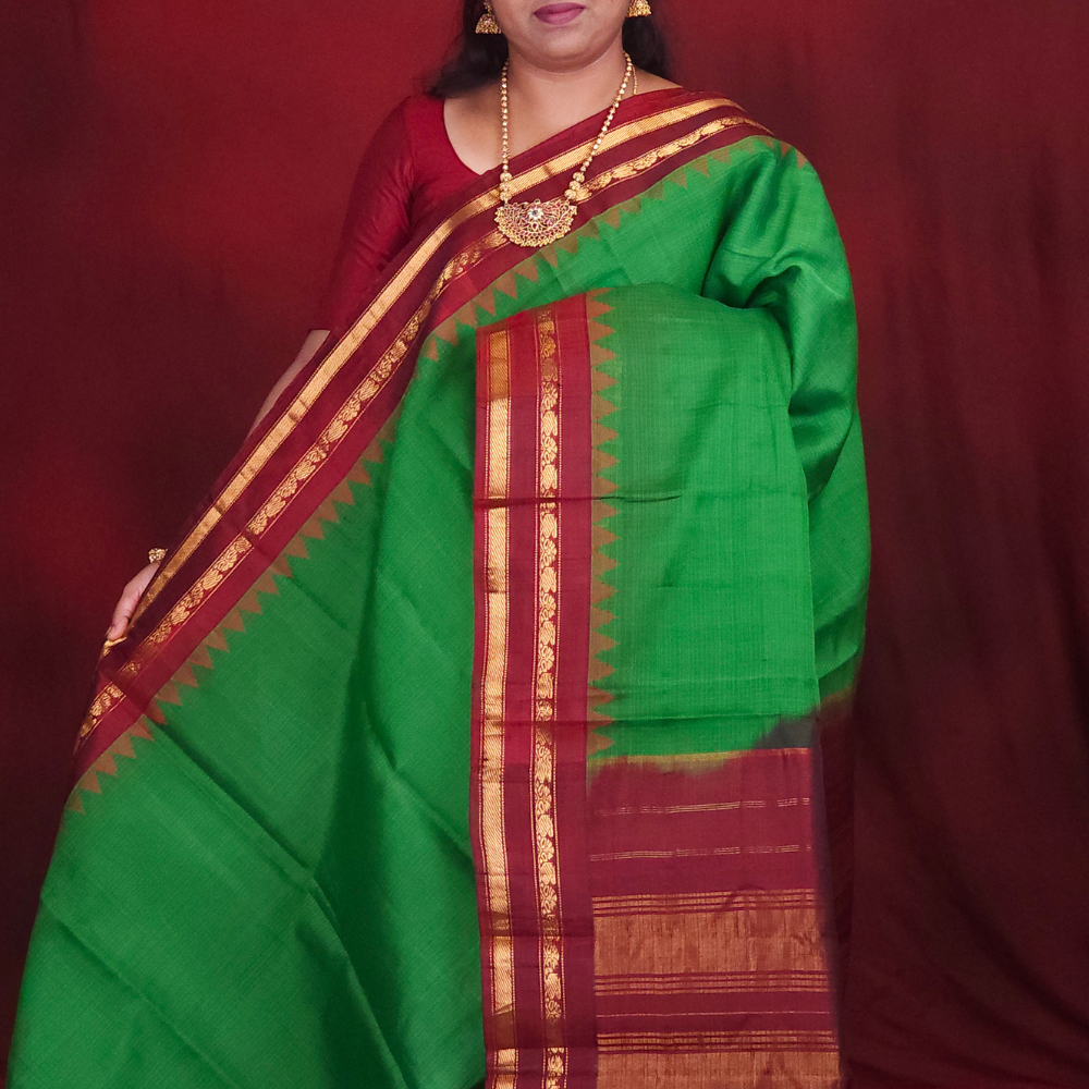 Lightweight Gadwal cotton saree featuring elegant zari border and striped pallu design.
