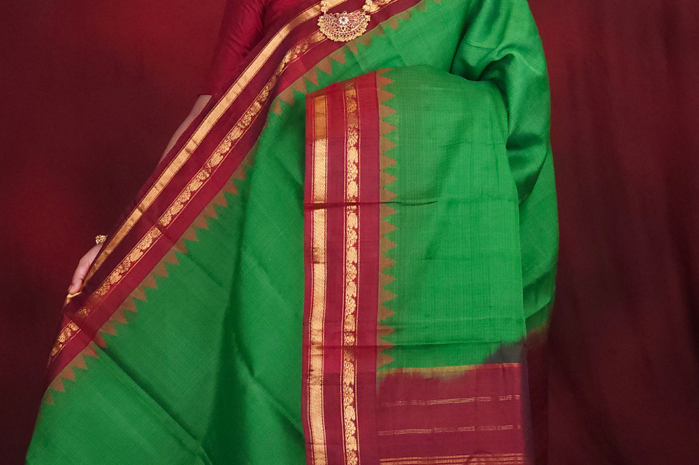 Lightweight Gadwal cotton saree featuring elegant zari border and striped pallu design.
