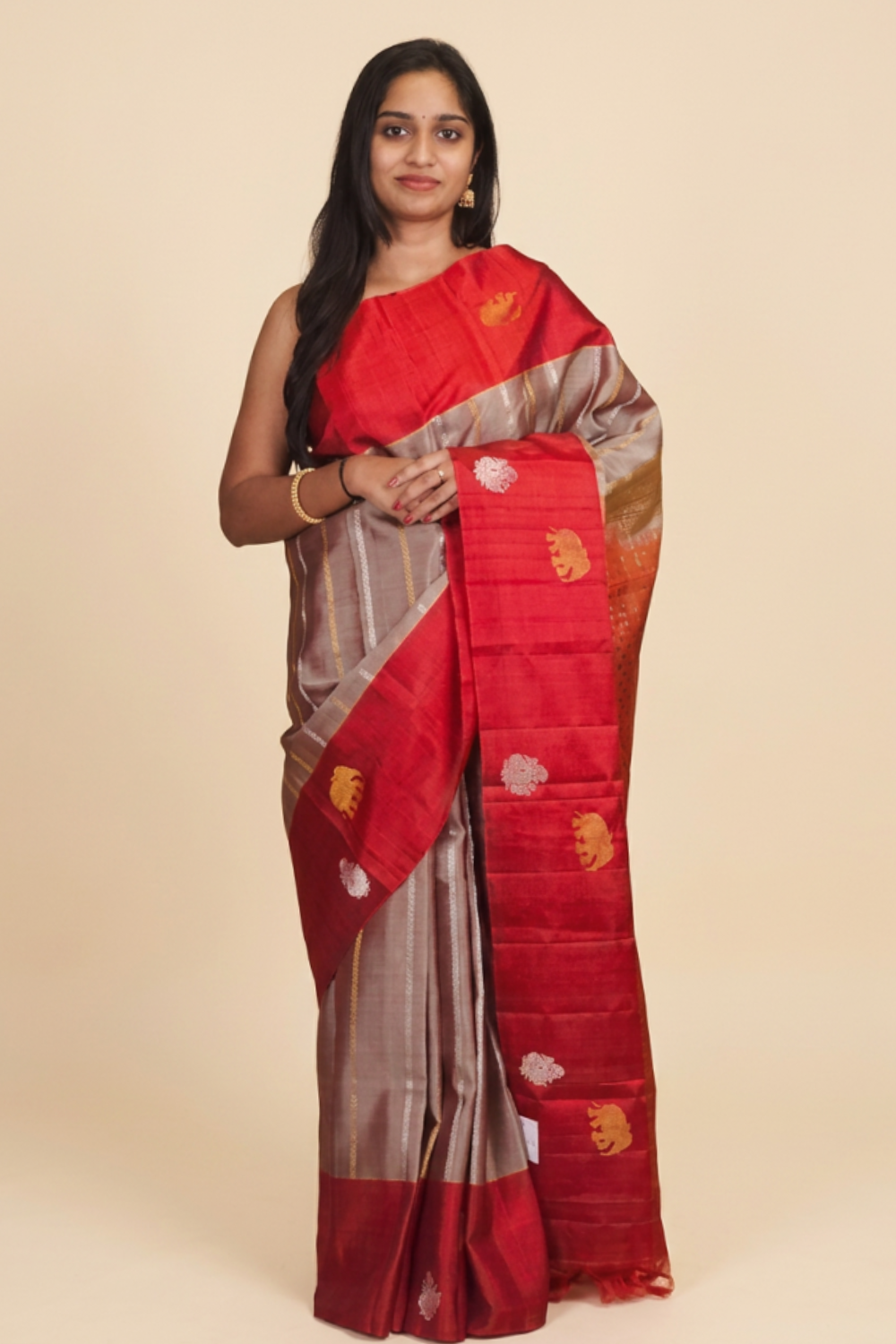 Pure handloom Gadwal silk saree with all-over zari motifs and intricate turning borders
