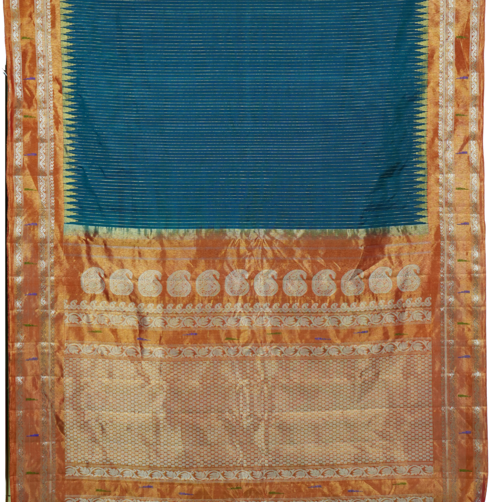 Traditional handloom Gadwal pure silk saree with zari woven tissue borders suitable for weddings.