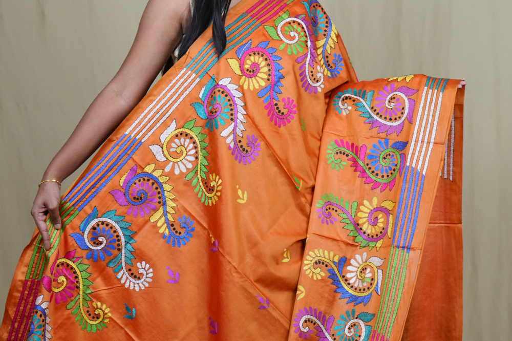 Elegant silk saree featuring Kantha work borders and detailed Kantha pallu design.