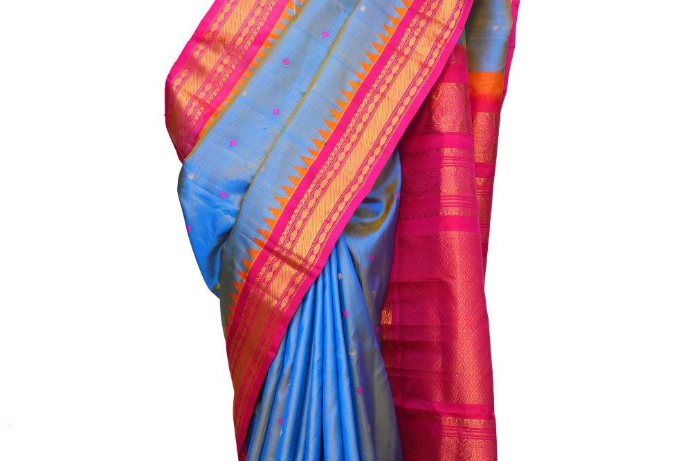 Handloom Gadwal pure silk saree with intricate small zari motifs and rich woven pallu.

