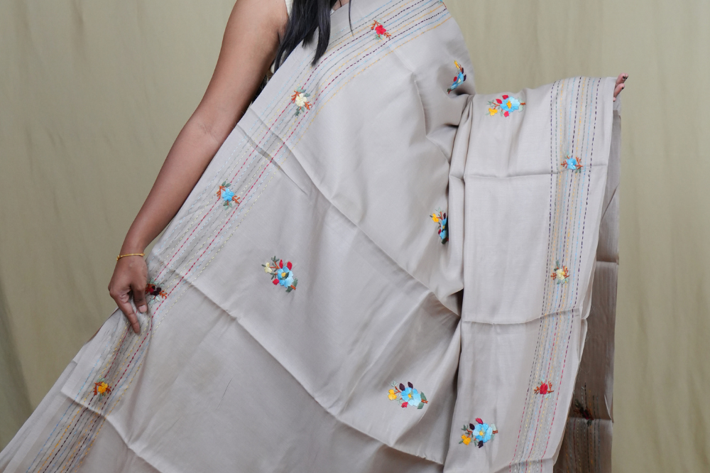 Traditional semi Tussar saree suitable for festive occasions with intricate Parsi work detailing.