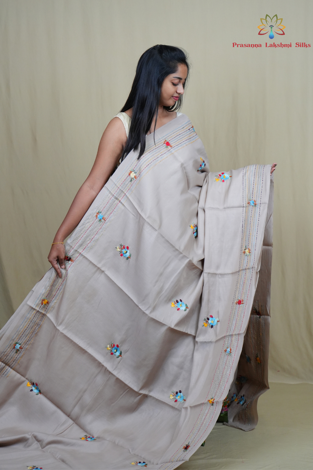Traditional semi Tussar saree suitable for festive occasions with intricate Parsi work detailing.