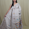 Semi Tussar saree with all-over thread woven motifs and rich Parsi work pallu.