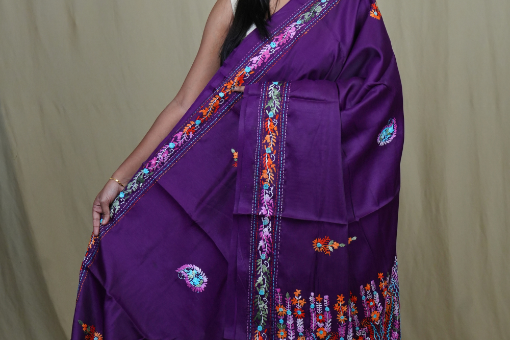 Semi Tussar saree with all-over thread woven motifs and rich Parsi work pallu.
