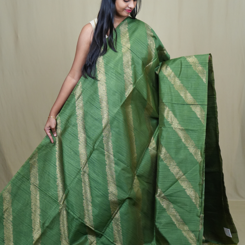 Premium Semi Dupion Silk Saree featuring intricate zari weaving, luxurious brocade pallu, and matching running blouse.
