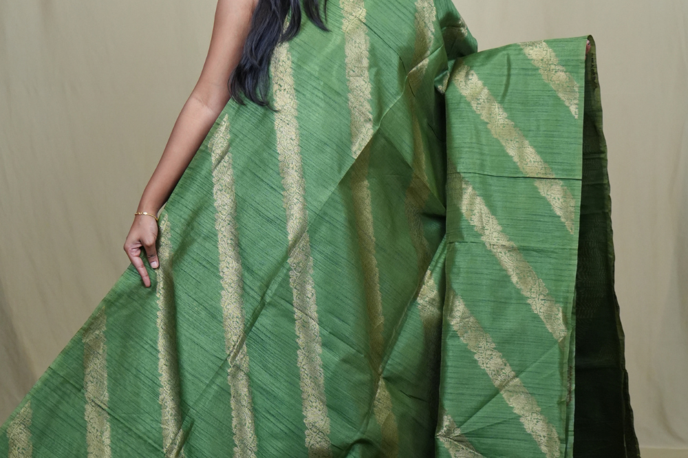 Premium Semi Dupion Silk Saree featuring intricate zari weaving, luxurious brocade pallu, and matching running blouse.
