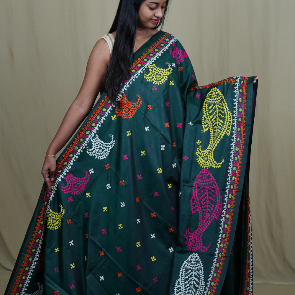 Elegant silk saree featuring Kantha work borders and detailed Kantha pallu design.
