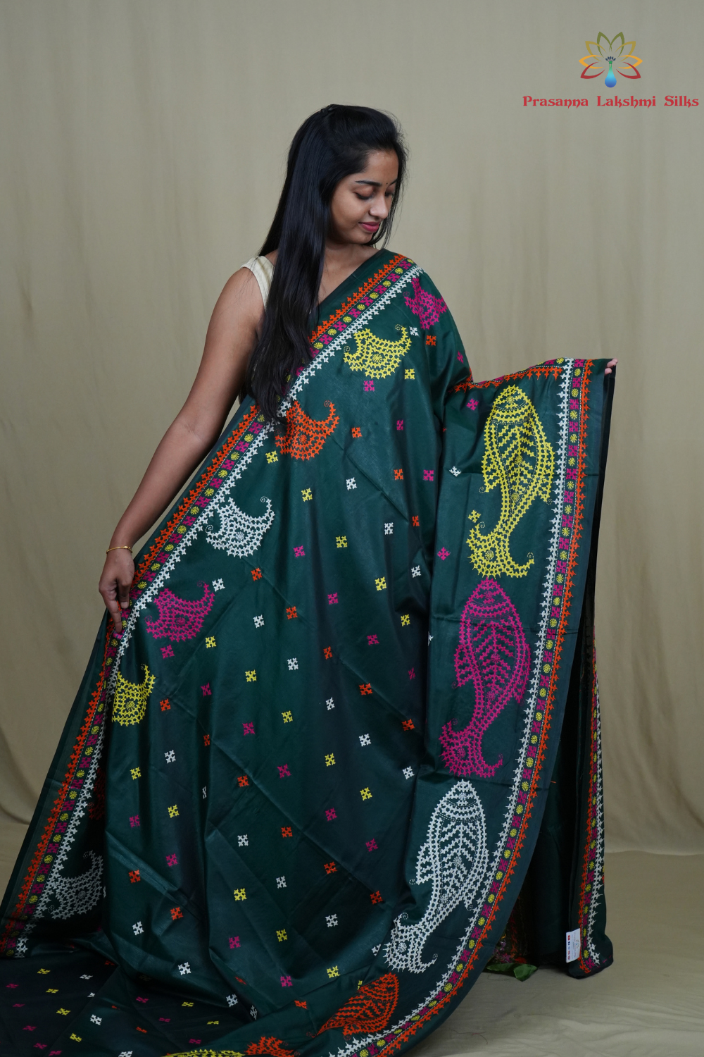 Elegant silk saree featuring Kantha work borders and detailed Kantha pallu design.
