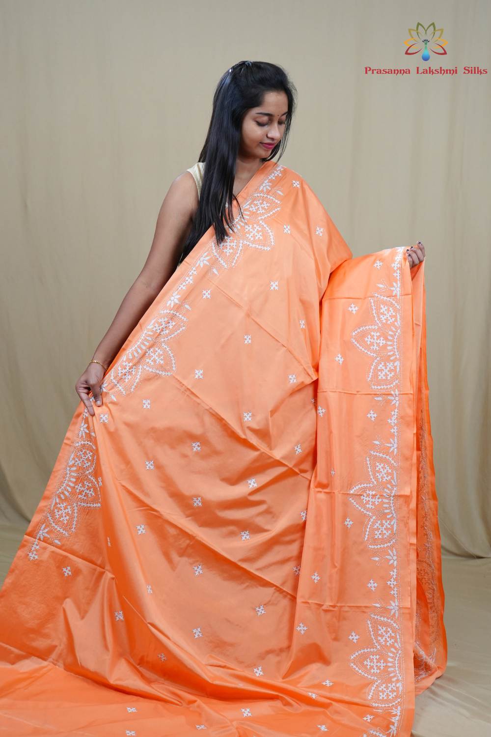 Traditional semi silk saree featuring beautiful hand Kutch work borders and artistic design.
