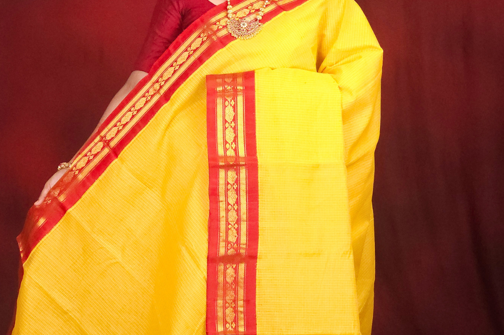 Lightweight Gadwal cotton saree featuring elegant zari border and striped pallu design.
