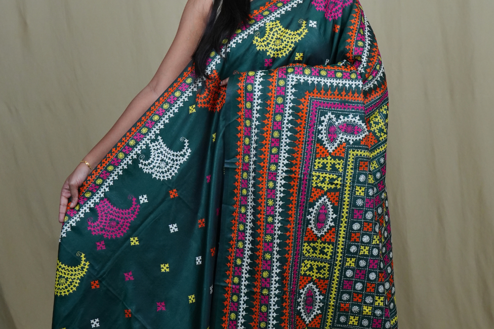 Semi Bangalore silk saree with all-over hand Kantha work and rich embroidered pallu.
