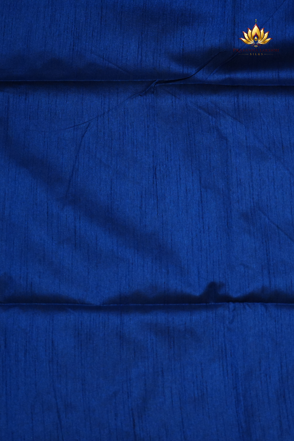 Premium Semi Dupion Silk Saree featuring intricate zari weaving, luxurious brocade pallu, and matching running blouse.
