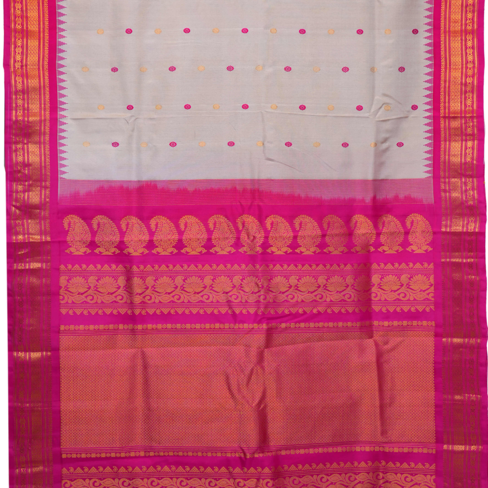 Handloom Gadwal pure silk saree with intricate small zari motifs and rich woven pallu.

