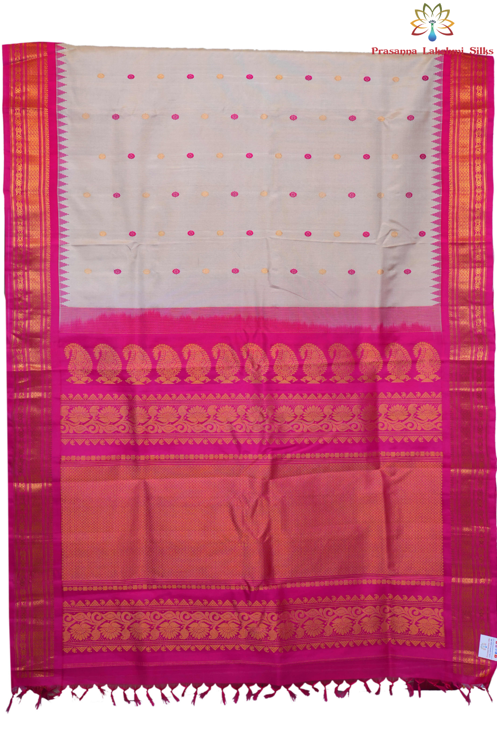 Handloom Gadwal pure silk saree with intricate small zari motifs and rich woven pallu.
