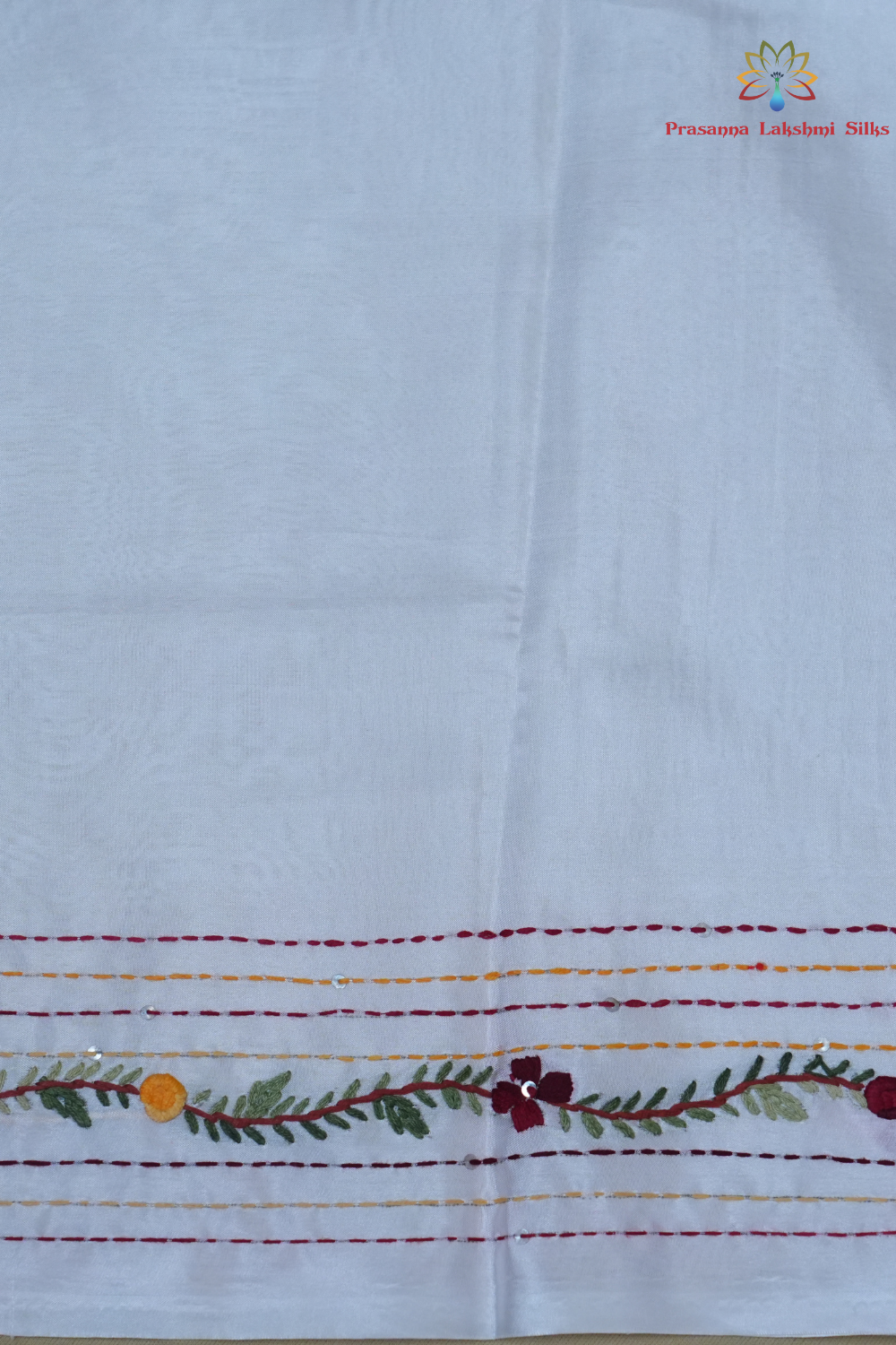 Elegant Tussar saree featuring thread woven Parsi work borders and running blouse piece.
