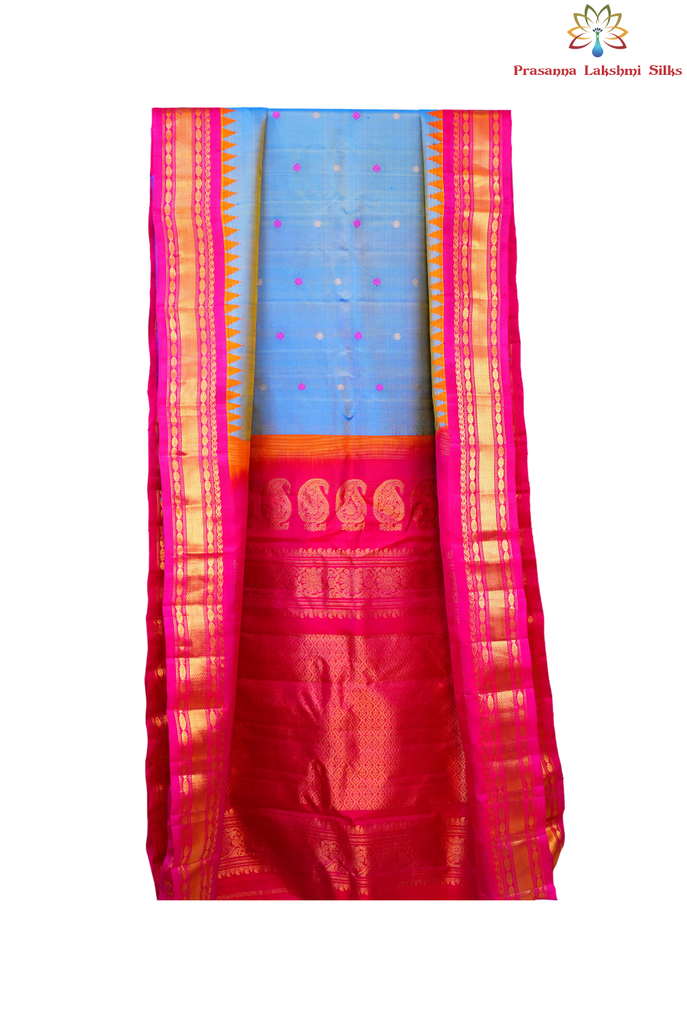 Traditional Gadwal silk saree featuring zari-woven borders and contrast blouse.
