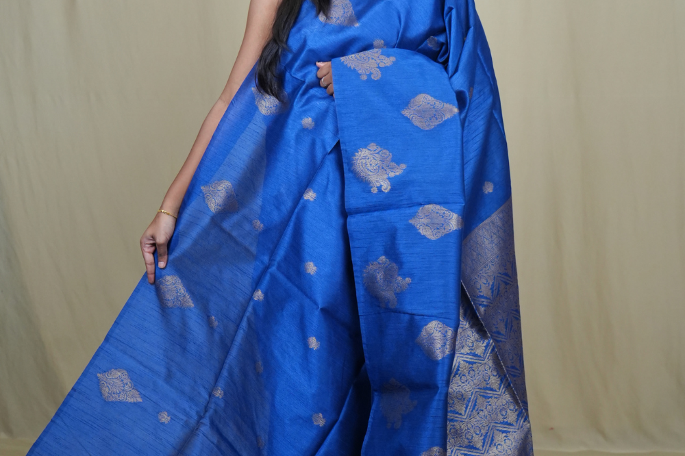 Semi Dupion Silk Saree with all-over zari woven motifs, rich brocade pallu, and elegant zari borders.
