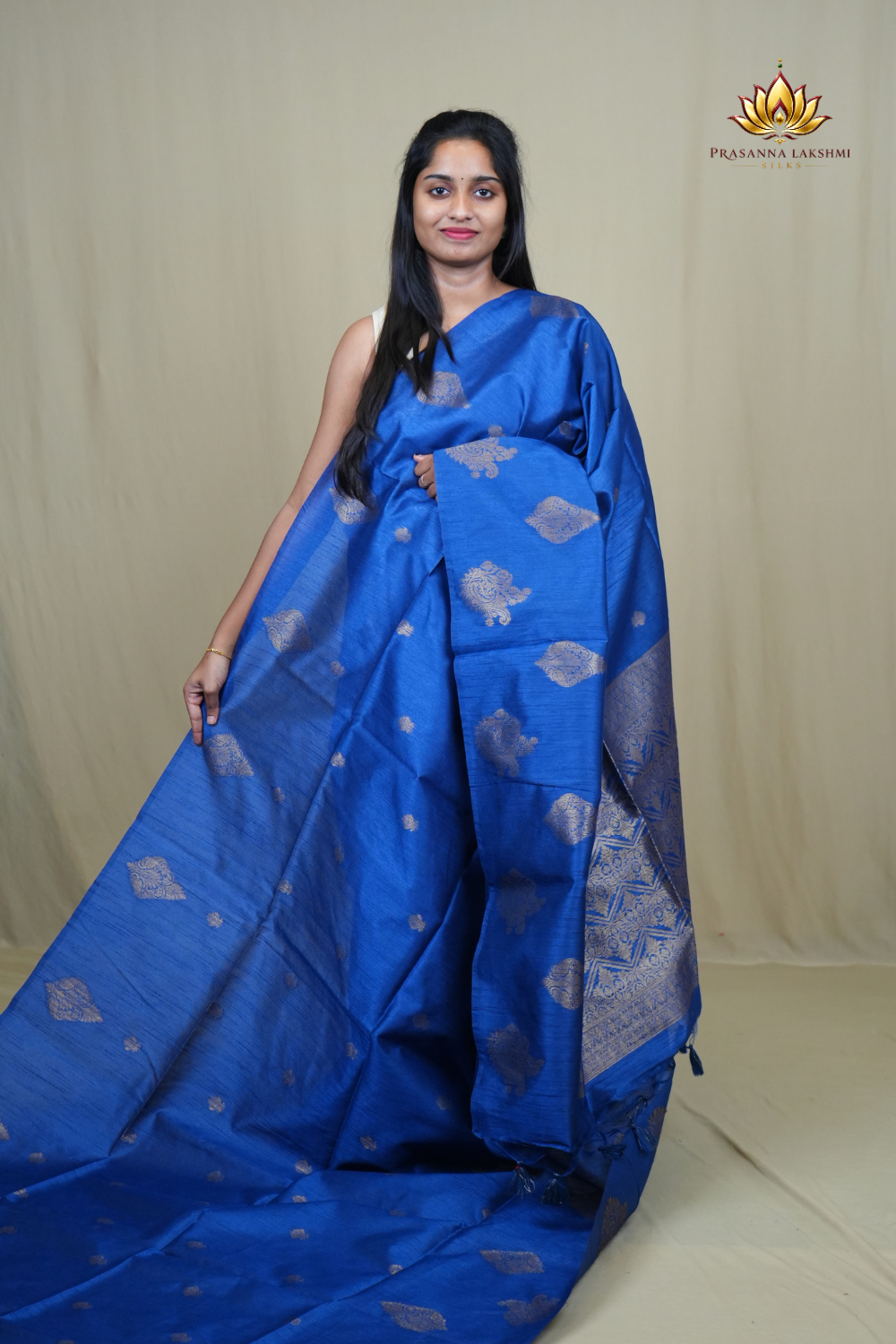 Semi Dupion Silk Saree with all-over zari woven motifs, rich brocade pallu, and elegant zari borders.
