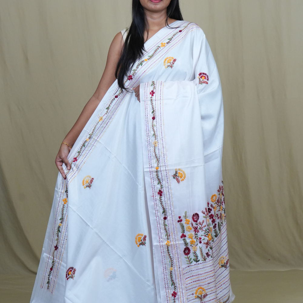 Semi Tussar saree with all-over thread woven motifs and rich Parsi work pallu.
