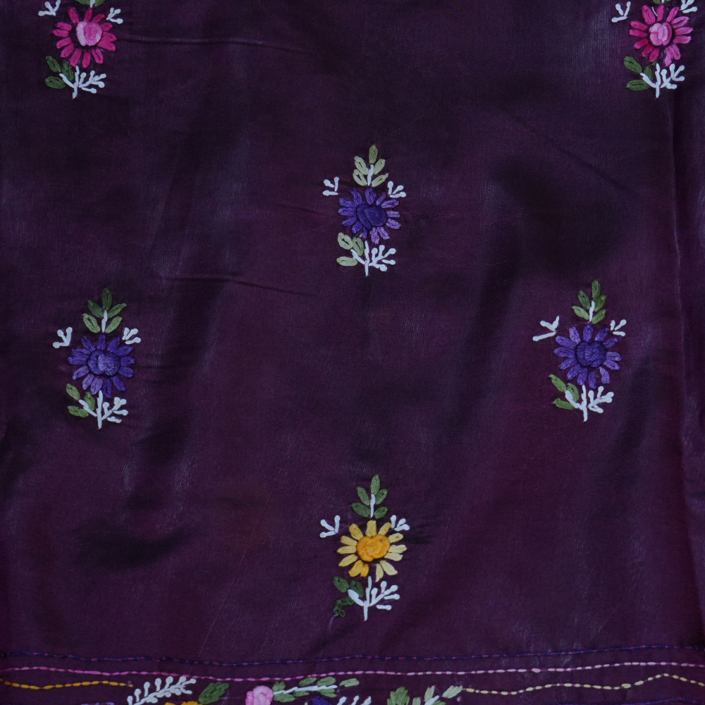 Elegant Tussar saree featuring thread woven Parsi work borders and running blouse piece.
