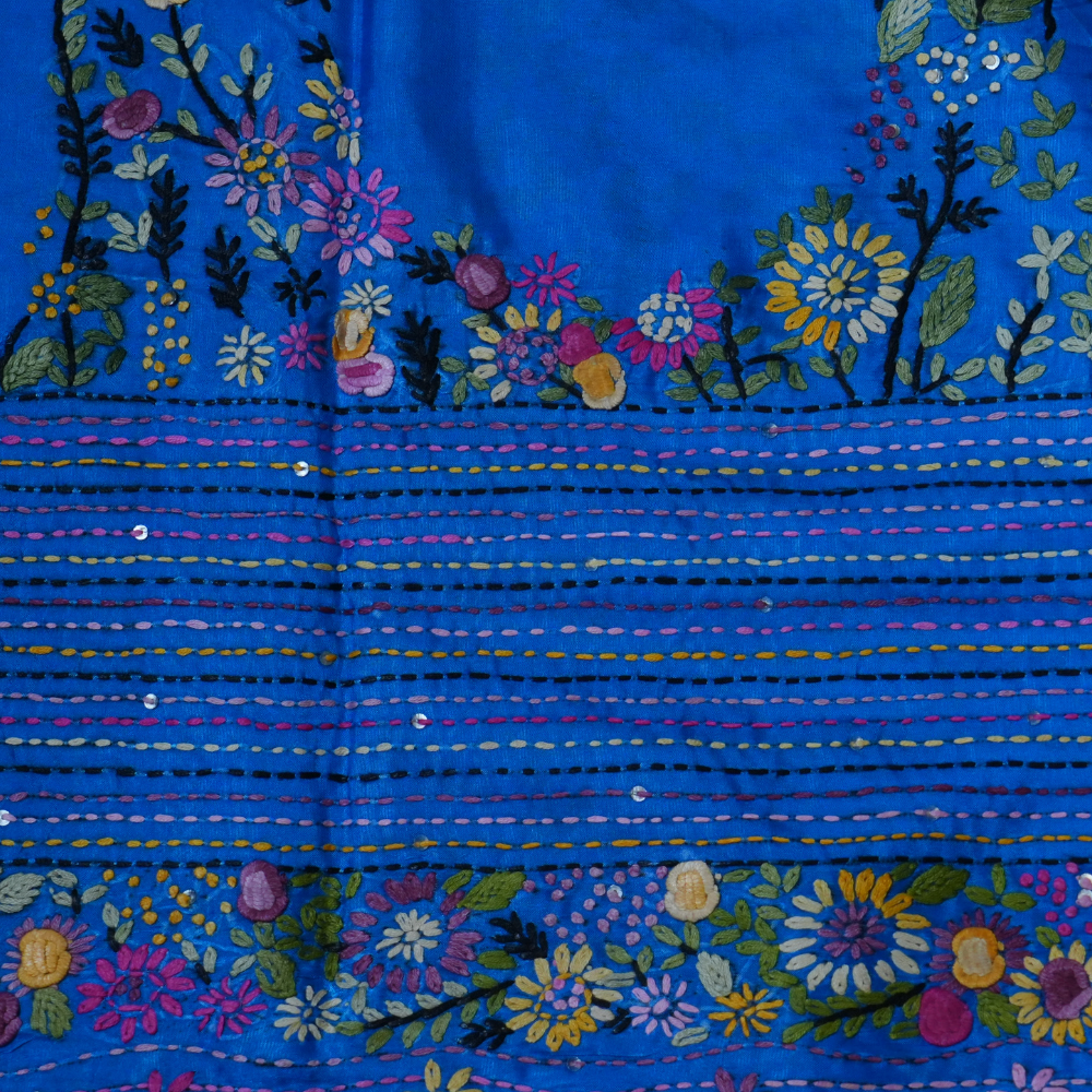 Elegant Tussar saree featuring thread woven Parsi work borders and running blouse piece.
