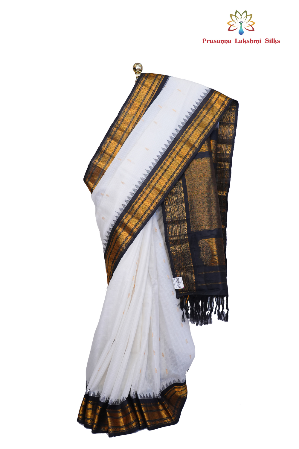 Handloom Gadwal silk cotton saree with all-over zari buttis and rich brocade pallu.

