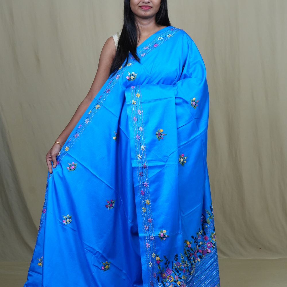Semi Tussar saree with all-over thread woven motifs and rich Parsi work pallu.
