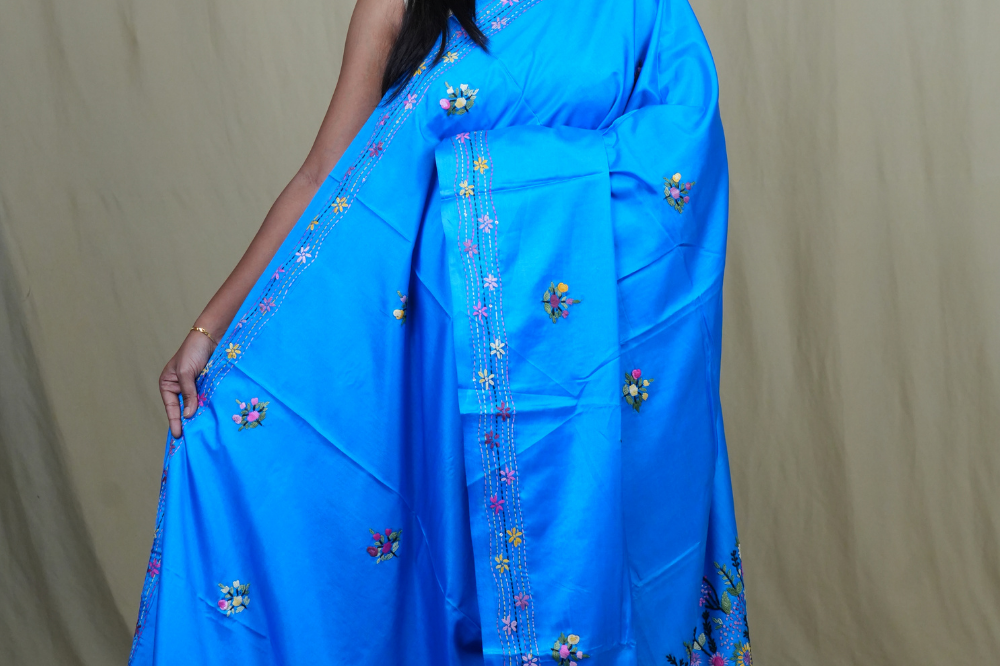 Semi Tussar saree with all-over thread woven motifs and rich Parsi work pallu.

