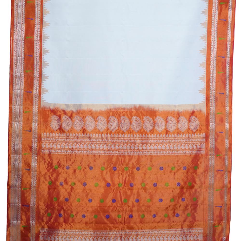 Traditional handloom Gadwal pure silk saree with zari woven tissue borders suitable for weddings.