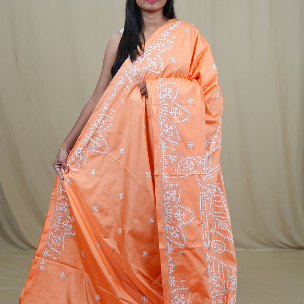 Semi Bangalore Silk Saree with all-over Kutch work motifs and rich embroidered pallu.
