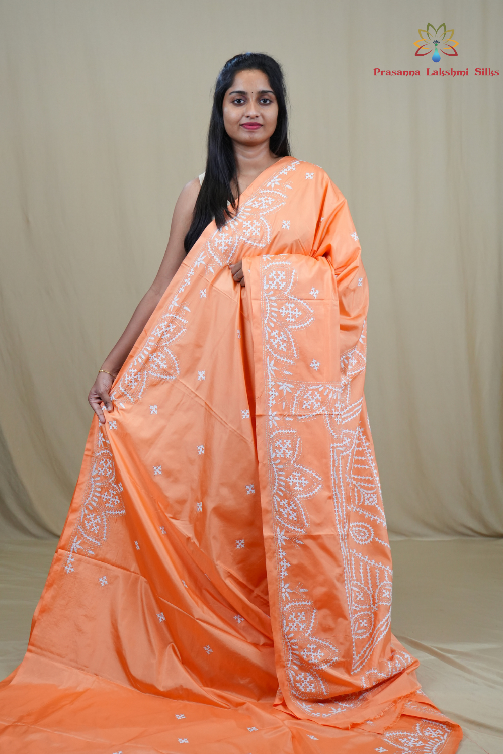 Semi Bangalore Silk Saree with all-over Kutch work motifs and rich embroidered pallu.
