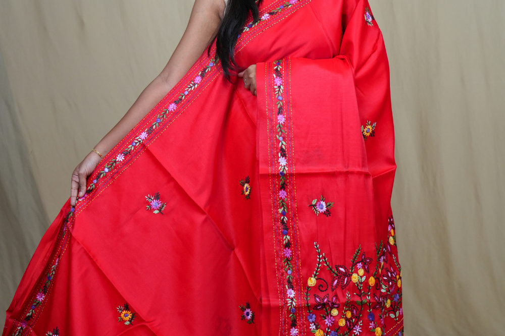 Semi Tussar saree with all-over thread woven motifs and rich Parsi work pallu.

