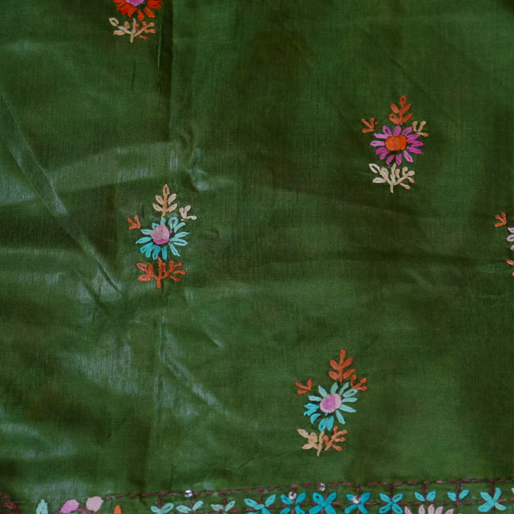 Elegant Tussar saree featuring thread woven Parsi work borders and running blouse piece.
