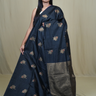 Semi Dupion Silk Saree with all-over zari woven motifs, rich brocade pallu, and elegant zari borders.
