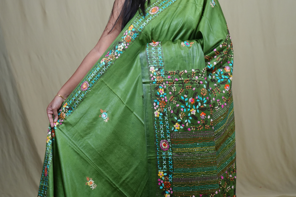 Semi Tussar saree with all-over thread woven motifs and rich Parsi work pallu.
