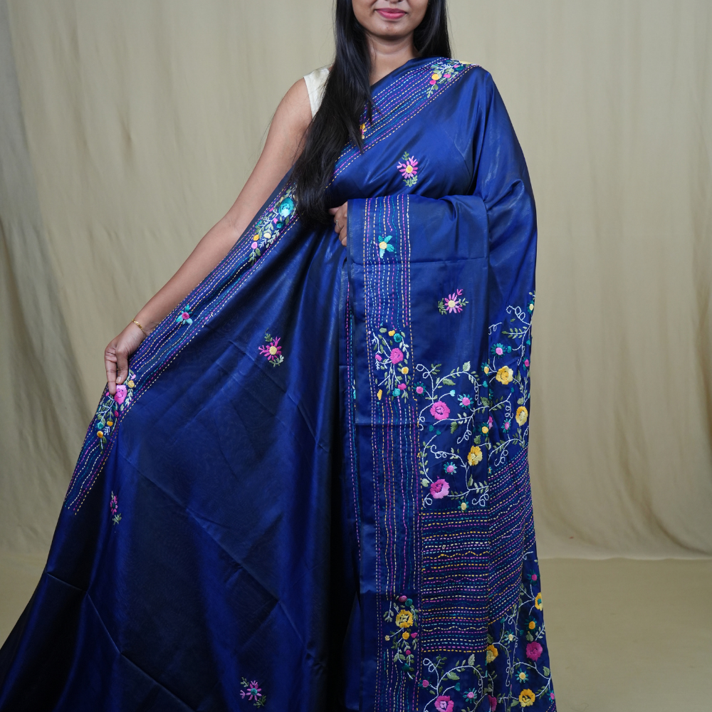 Semi Tussar saree with all-over thread woven motifs and rich Parsi work pallu.
