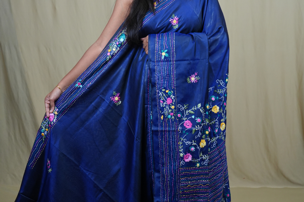 Semi Tussar saree with all-over thread woven motifs and rich Parsi work pallu.
