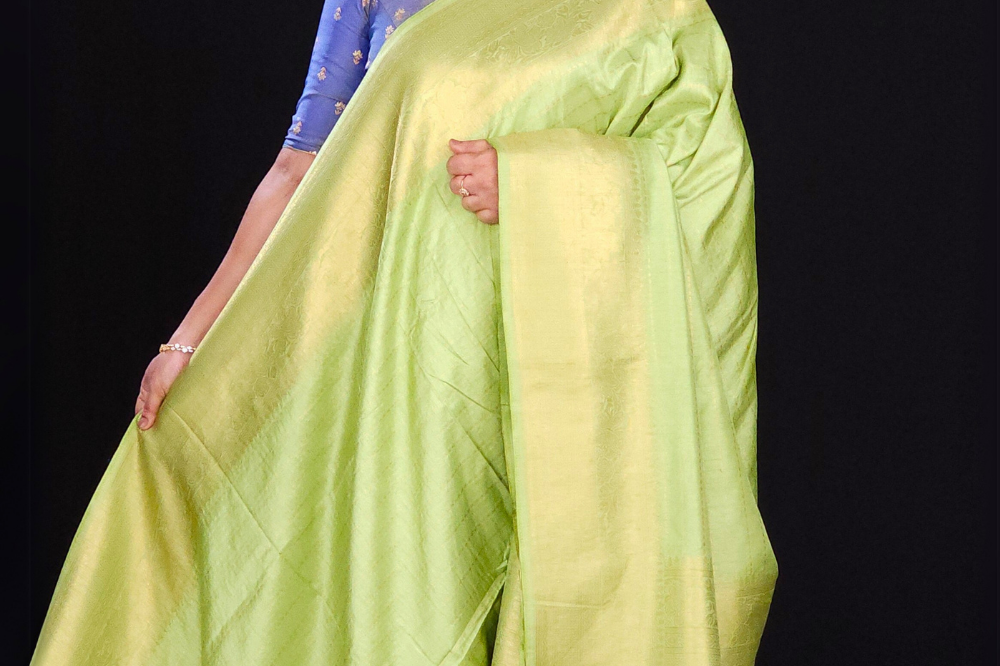 pista green Lightweight georgette saree with contrast pallu