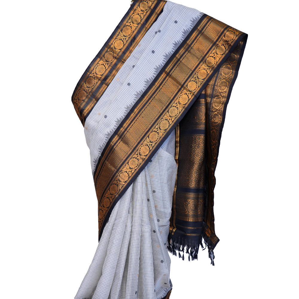 Traditional Gadwal SiCo saree featuring exquisite zari woven borders and blouse piece.
