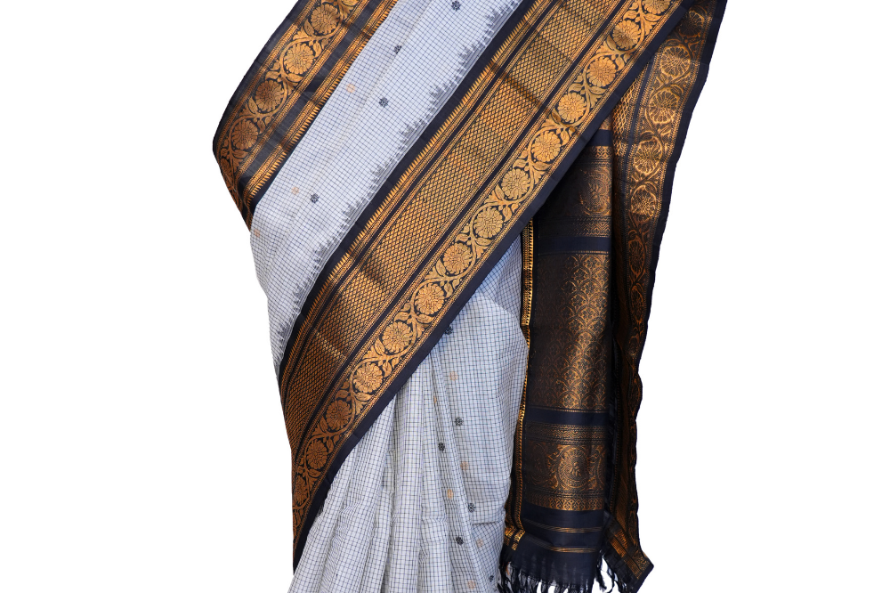Traditional Gadwal SiCo saree featuring exquisite zari woven borders and blouse piece.
