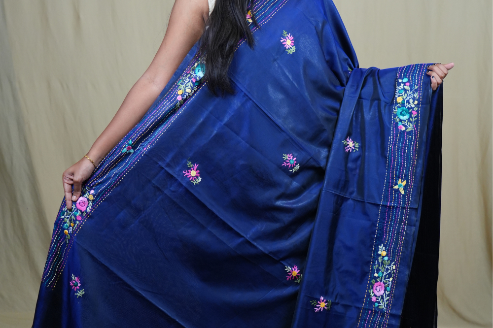 Traditional semi Tussar saree suitable for festive occasions with intricate Parsi work detailing.