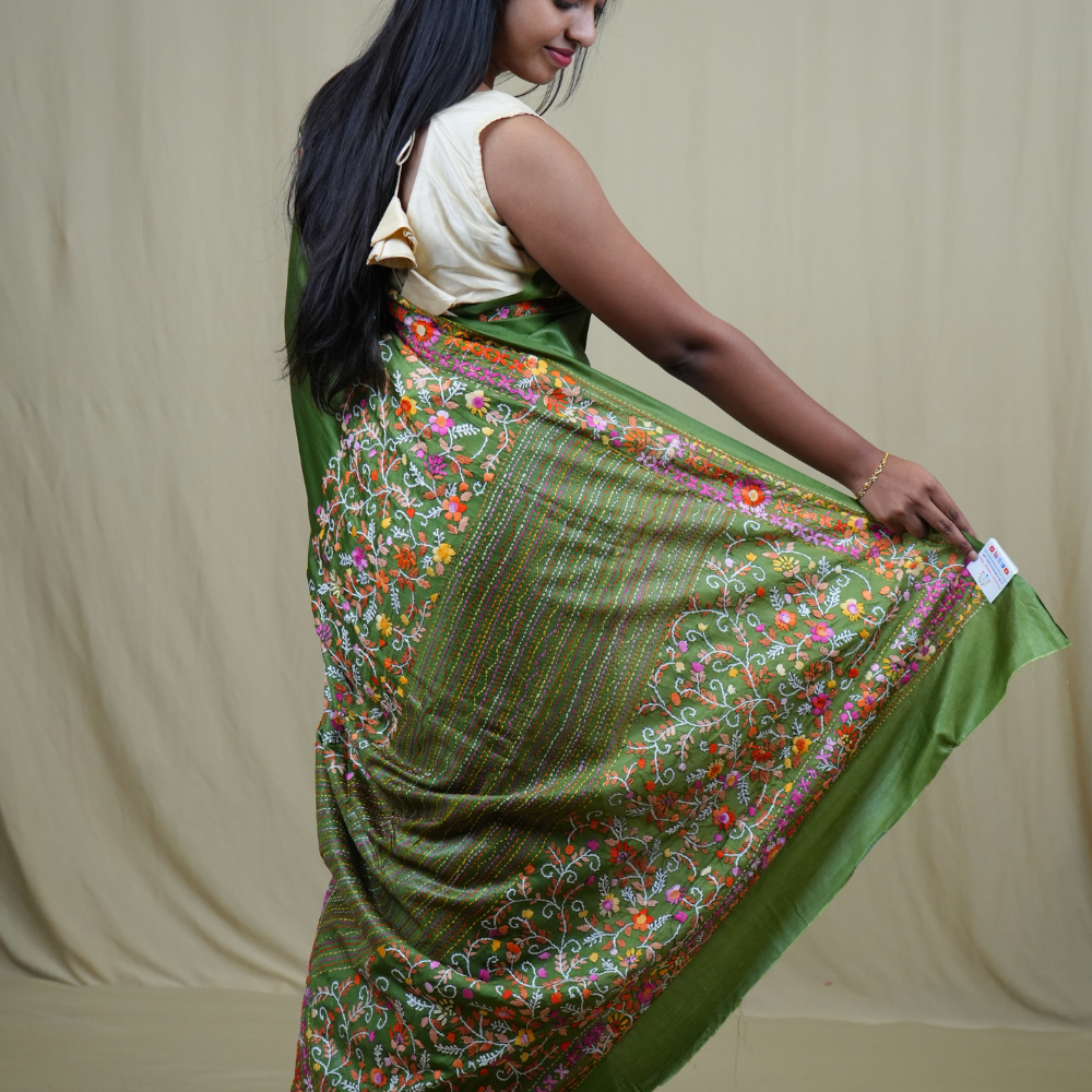 Semi Tussar saree with all-over thread woven motifs and rich Parsi work pallu.
