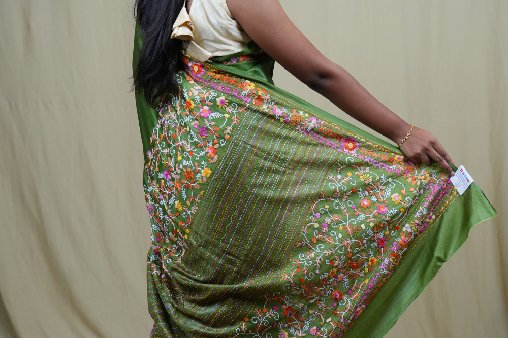 Semi Tussar saree with all-over thread woven motifs and rich Parsi work pallu.
