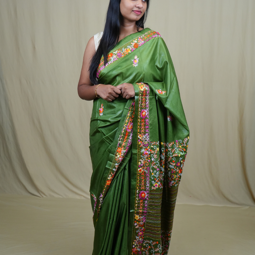 Semi Tussar saree with all-over thread woven motifs and rich Parsi work pallu.
